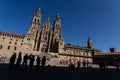 Pilgrims Silhouette against the Santiago de Compostela Cathedral during a Sunny Day. Royalty Free Stock Photo
