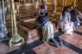 Pilgrims at the Stone of Anointing at the Church of the Holy Sepulchre Royalty Free Stock Photo