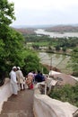 The pilgrims visiting Hanuman Temple at Anjana mountain of Hampi crossing the river