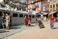 Pilgrims walk around the Bodhnath Stupa