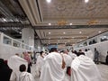 Pilgrims walk between the hills of Safa and Marwah. Royalty Free Stock Photo