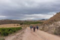 Pilgrims walking in Camino de Santiago in Navarre, Spain.