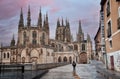 Pilgrims walking the Camino de Santiago, passing by the cathedral in the city of Burgos, Way of Saint James Royalty Free Stock Photo