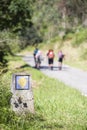 Pilgrims walking through Way of St James , Camino de Santiago , sign shells marks to Compostela Cathedral ,Galicia, Spain. people