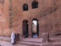 Piligrim near lalibela church bell tower stone wall