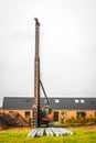 Piling machine in a single family neighborhood Royalty Free Stock Photo