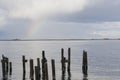 Pilings and rainbow