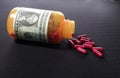 Pill Bottle with Dollar Script Royalty Free Stock Photo