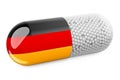 Pill capsule with German flag. Healthcare in Germany concept. 3D rendering