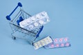 pill cart shopping medicine pharmacy blue background Royalty Free Stock Photo