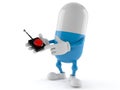 Pill character pushing button on white background