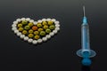 Pill heart and syringe