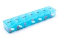 Pill organizer with variety of pills and supplement. a plastic weekly