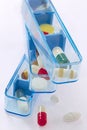 Pill and pill container weekly pillbox Royalty Free Stock Photo