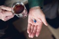 A pill in someone`s hand