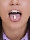 Pill on the tongue Royalty Free Stock Photo