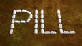 PILL WORD ON A RUSTY METAL PLATE