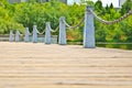 Pillar and chain fence down on a lake side