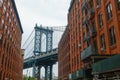 Pillar of Manhattan Bridge from alley in Dumbo district in Brooklyn Royalty Free Stock Photo