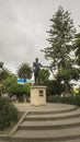 View of the bronze monument to General Jose Maria Urbina in the middle of the central park of Pillaro during a cloudy day