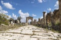 Pillars along byzantine road with triumph arch in ruins of Tyre, Lebanon Royalty Free Stock Photo