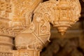 Pillars with ancient carvings of stone sanctuary in Jain temples, India.