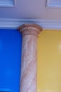 pillars of a building with walls on different colored sides