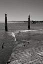 Pillars of Do Comercio square on the Banks of Tagus river in Lisbon Royalty Free Stock Photo