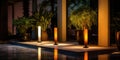 Multicolored glass pillars with light sources , accent lighting of the street near the hotel