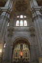 Pillars, vaults and stained glass windows in a altarpiece in Malaga Cathedral