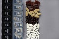 Pillbox by day next to different dietary supplements and tablets Royalty Free Stock Photo