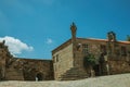 Pillory in the middle of square encircled by old houses Royalty Free Stock Photo