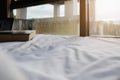 Pillow and book on white bed