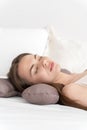 A girl sleeping on a special beauty pillow with a silk pillowcase. Vertical photo with copyspace Royalty Free Stock Photo