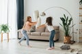 Pillow fight. Kids having fun in the domestic room at daytime together Royalty Free Stock Photo