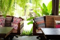 pillow on wooden settee bench on terrace patio near garden