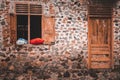 Pillows and bolsters that are drying on the window