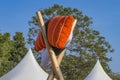 Pillows on display on poles