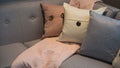 Pillows on a grey modern corner sofa Royalty Free Stock Photo