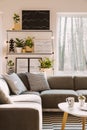 Pillows with pattern on grey corner couch standing in bright Nor