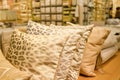 Pillows warm pastel colors in soft light on the sofa in the store. Background