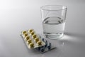 Pills Blister along with a water glass Royalty Free Stock Photo