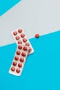 Pills in blister packs of vitamins on a blue background. Royalty Free Stock Photo