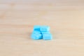 pills blue On wooden floor with copy space add text