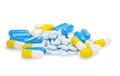 Pills blue, yellow and light blue tablets on a isolated white bac