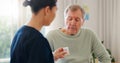 Pills bottle, elderly man and caregiver explain product info, wellness medicine or prescription drugs. Sick patient