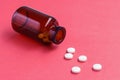 pills with bottle on red background,Copy space for text Royalty Free Stock Photo