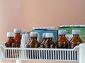 Pills, bottles with tinctures and liquid medicines on a shelf in a pharmacy, hospital, laboratory, clinic, home medicine cabinet.