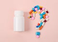 Pills or capsules as a question mark. Royalty Free Stock Photo