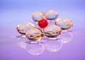 Pills (capsules) of cod-liver oil on violet Royalty Free Stock Photo